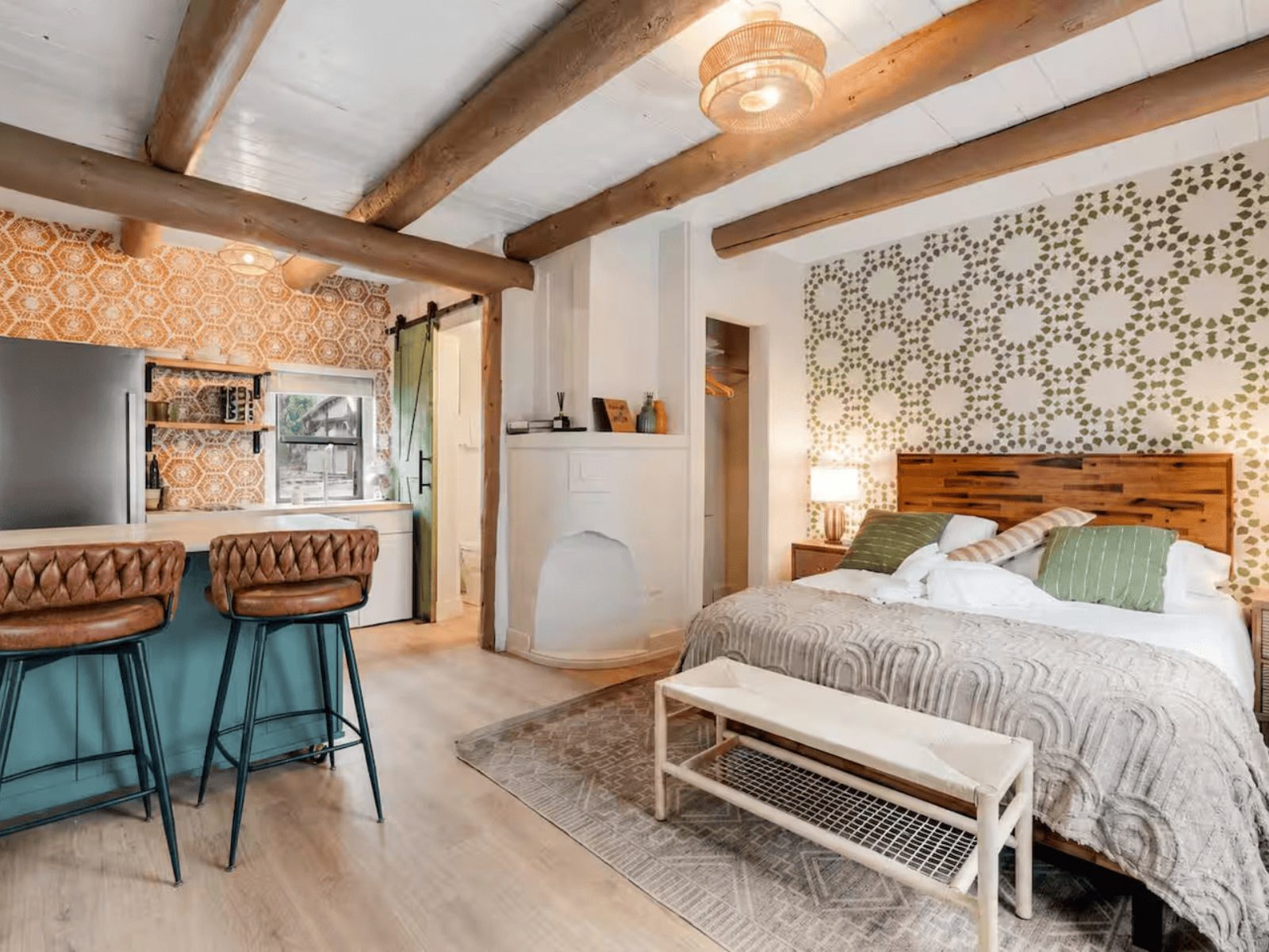 Studio casita with a queen bed, breakfast bar and kitchen in one open room